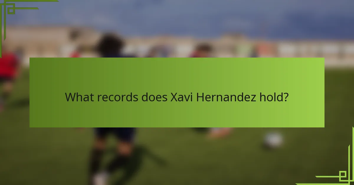 What records does Xavi Hernandez hold?